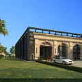 European Style Architecture With Beige Exterior Arched Doors Green Lawn White Car And Trees