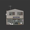 Two Story Small Shop Building With Light Colored Walls Dark Roof And Entrance Bags Buckets