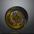 Car Wheel Featuring Golden Rim Black Tire And ADVAN Brand Stylish Design