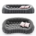 Modern Gray Curved Sectional Sofa with Tufted Texture and Pink Cushions
