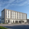 Modern Office Building With Gray And White Exterior Large Windows And Parking Lot