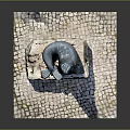 Detailed Seal Statue Perched On Weathered Stone Base With Cobblestone Pavement