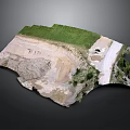 Open Pit Mine Excavation Site With Green Vegetation Sandy Ground And Access Road