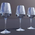 Three Transparent Stemmed Wine Glasses Filled With Water On Dark Surface Grey Background