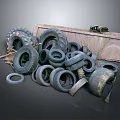 Pile of Old Used Tires Stacked on Metal Pallet with Various Sizes and Worn Surfaces