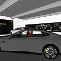 4S Shop Showroom Featuring White Car on Circular Display Platform With Car Posters on Back Wall