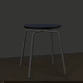 Modern Minimalist Stool With Blue Round Seat And Silver Metal Legs On Wooden Floor