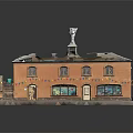 Two Story Brown Building With Roof Tower Front Steps Colorful Bunting And Flower Baskets