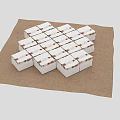 White Cubes Neatly Arranged On Brown Burlap Cloth With Dark Brown Background