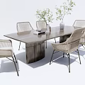 Outdoor Garden Table With Modern Wooden Tabletop And Woven Chairs With Green Plants