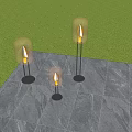 Stylish Floor Standing Outdoor Lights With Transparent Shades Flame Effect And Green Plants