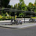 Outdoor Motorcycle Parking Canopy With Trees And Greenery In Urban Setting