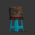 Carved Brown Container With Red Base On Blue Stool Shaped Stand