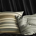 Soft Striped Decorative Pillows In Neutral Tones On Dark Fabric Surface 3d model