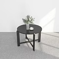 Minimalist Black Round Dining Table With Greenery Vase And White Cup Saucer