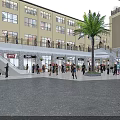 Vibrant Commercial Street With Pedestrians Shops Modern Buildings And Outdoor Seating