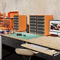 Functional Home Office Desk With Orange Drawer Cabinets Computer Monitor And Stone Worktop
