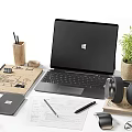Modern Workspace Setup With Laptop Headphones Coffee Mug Apple And Office Supplies