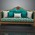 Classic Turquoise Sofa With Ornate Golden Carvings And Patterned Fabric Pillows