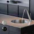 Modern Black Silver and White Faucet with Water Flowing on Kitchen Countertop