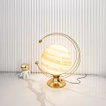 Gold Celestial Table Lamp With Planet Sphere Shade Metal Ring Frame And Astronaut Figurine