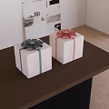 Decorative White Gift Boxes With Colored Ribbons And Bowknots On Wooden Table