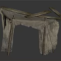 Primitive Tent Structure With Crossed Wooden Poles And Tattered Fabric Cover