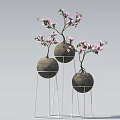 Pink Flowering Plants in Spherical Pots on White Metal Stands