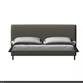 Modern Minimalist Double Bed Featuring Light Gray Fabric Headboard White Pillows And Dark Gray Blanket