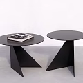 Two Black Round Coffee Tables with Triangular Bases and Black and White Book on Top 3d model