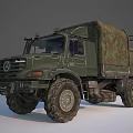 Green Military Truck With Camouflage Cargo Cover And Off Road Tires