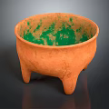 Three Legged Ceramic Pottery Bowl With Orange Exterior And Green Mottled Interior