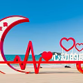 Red Moon Shaped Heart Heartbeat Line Sculpture Photo Spot On Beach With Blue Sea Sky