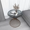 Stylish Coffee Table With Metal Wire Frame Glass Top And Dried Pampas Grass Near Sofa