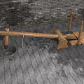 Wooden Garden Ornament With Seesaw Like Structure Against Brick Wall And Stone Pavement