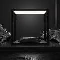 Illuminated Square Frame Display With Central Stone And Surrounding Rocks On Black Background 3d model