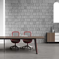 Long Brown Conference Table With Black Legs Red Chairs Gray Brick Wall And Arched Window