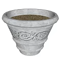 Light Colored Ceramic Planter With Carved Patterns And Soil Inside