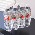 Pure Natural Mineral Water In Transparent Bottles With Red Labels On Black Table