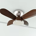 Modern Ceiling Fan with Wooden Blades and Silver Metal Base Mounted on White Ceiling