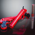 Red Toy Gun With Black Grip And Silver Cylinder Accessory On Dark Surface