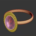 Elegant Gold Ring With Red Gemstone And Intricate Golden Decorative Edge