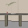 Minimalist Modern Dining Table with Black Tabletop Two Cylindrical Legs Vase Green Plant and Book