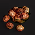 Fresh Walnuts In Green Glass Bowl With Some Scattered Outside On Dark Surface