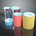 Colorful Food Cans In Various Sizes And Metallic Finishes On Black Surface
