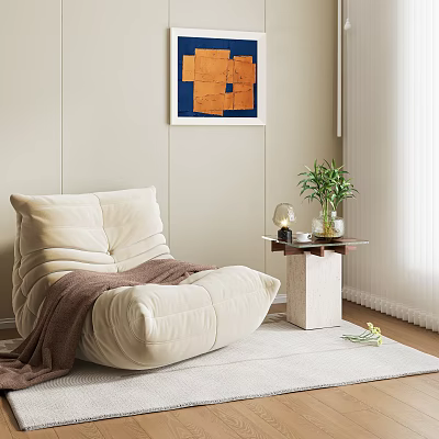 Beige Bean Bag Chair With Brown Blanket Side Table And Plant Decor On Light Rug 3d model