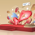 Artistic Stage Setup With Red Platform And Colorful Installations Including Suning AU Logos
