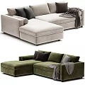 L shaped Sectional Sofa in Neutral and Green Tones with Multiple Decorative Cushions and Gray Throw Blanket