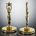 Golden Trophies with Female Figure Holding Star and Spire on Reflective Black Base