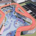 Vibrant Plaza Landscape With Red Winding Slides Blue Ground And Play Elements